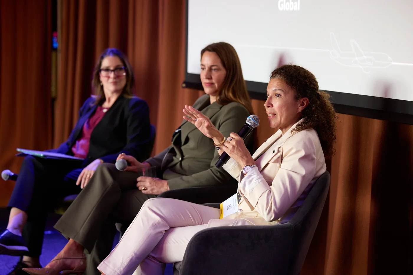 A speaker addressing the room during a Women in SAF panel